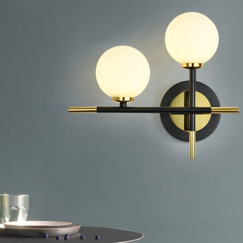 Sikunuo | Milk glass orb wall light with cross design 2 lights modern black and brass wall light