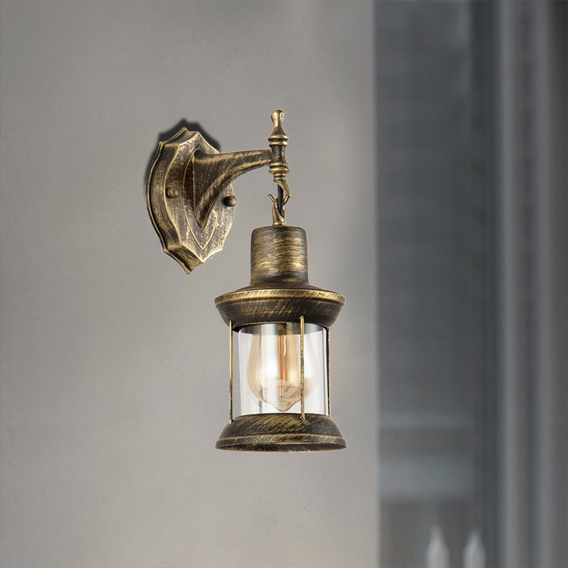Sikunuo | An E27 wall light with a petroleum shade made of clear glass Traditional outdoor wall light in antique bronze