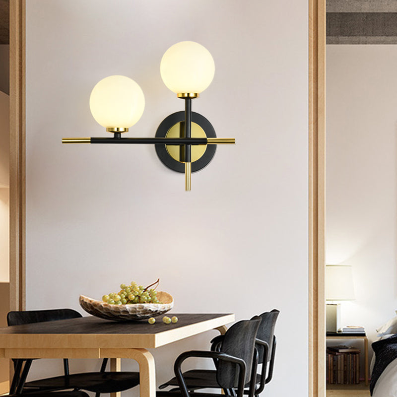 Sikunuo | Milk glass orb wall light with cross design 2 lights modern black and brass wall light