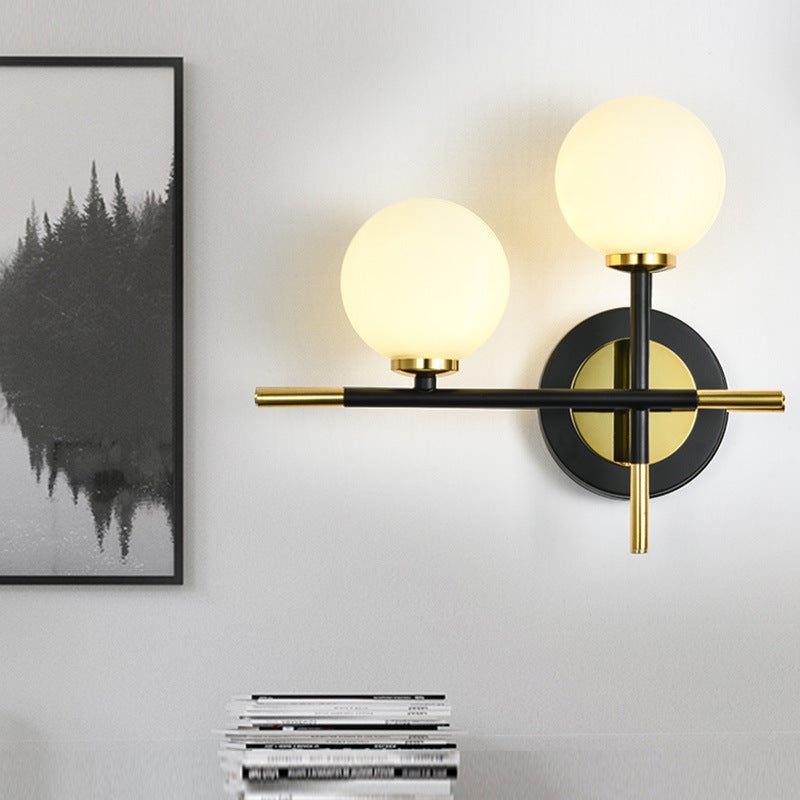 Sikunuo | Milk glass orb wall light with cross design 2 lights modern black and brass wall light