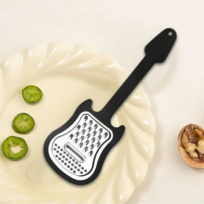 Sikunuo | Vegetable peeler made of stainless steel – Guitar-shaped peeler for peeling & slicing