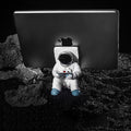 Support for phones or pens in astronaut decorations