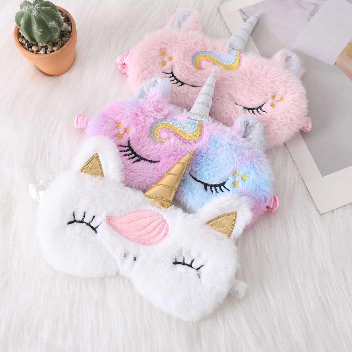 Ladies nan cozy unicorn sleep mask with embroidered eyelashes, soft plush and elastic ruffled ribbon 
Maetiva