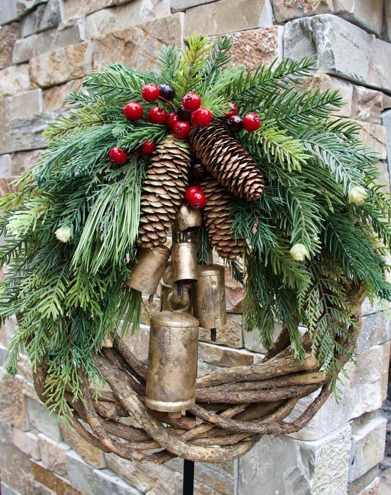 Cozy Christmas wreath with natural bells and wooden accents